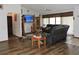 Spacious living room with modern furnishings and hardwood floors at 7591 Limonia Dr, Indian Lake Estates, FL 33855