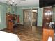 Bright main bedroom featuring a desk, chair and sliding glass doors at 7591 Limonia Dr, Indian Lake Estates, FL 33855