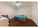 Bright bedroom with hardwood floors, a ceiling fan, and a comfortable bed at 821 Orchid Springs Dr # 821, Winter Haven, FL 33884