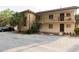 Beige two-story apartment building with stone accents and parking lot at 821 Orchid Springs Dr # 821, Winter Haven, FL 33884