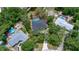 Aerial view of property with tree coverage and nearby homes in the neighborhood at 882 Redwood Way, Lake Wales, FL 33898