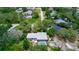 Aerial shot of house featuring pool, patio, and large mature trees at 882 Redwood Way, Lake Wales, FL 33898