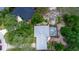 Aerial view of neighborhood with trees and green spaces around well-maintained homes at 882 Redwood Way, Lake Wales, FL 33898