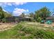 Enjoy the spacious backyard featuring a fire pit area, and lots of space for outdoor activities and gatherings at 882 Redwood Way, Lake Wales, FL 33898