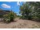 Backyard view showing the screened-in pool area with plenty of room to roam around at 882 Redwood Way, Lake Wales, FL 33898