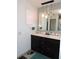 This full bathroom has a double vanity, nice mirror and great lighting at 882 Redwood Way, Lake Wales, FL 33898