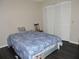 Bedroom with a comfortable bed, hardwood floors and closet at 882 Redwood Way, Lake Wales, FL 33898