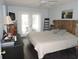 This bedroom has access to the outdoors, dark floors, and light blue walls at 882 Redwood Way, Lake Wales, FL 33898