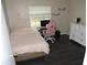 Bedroom features a white dresser, desk, and dark wood floors at 882 Redwood Way, Lake Wales, FL 33898