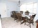 Inviting dining area with natural light from the bay window, offering a view of the backyard at 882 Redwood Way, Lake Wales, FL 33898