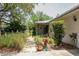 Inviting front porch with a charming welcome sign, lush plants, and cozy decor at 882 Redwood Way, Lake Wales, FL 33898