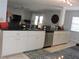 Bright kitchen showcasing granite countertops, stainless appliances, and an open layout flowing into living areas at 882 Redwood Way, Lake Wales, FL 33898