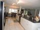 Large kitchen with stainless steel appliances, dining area, and an open layout for seamless entertaining at 882 Redwood Way, Lake Wales, FL 33898