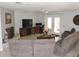 Inviting living room with neutral walls, tile floors, a fireplace, and ample seating at 882 Redwood Way, Lake Wales, FL 33898