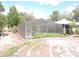 Enclosed screened in-ground pool with lush surrounding landscape offering a private outdoor retreat at 882 Redwood Way, Lake Wales, FL 33898
