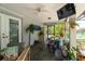 Bright and airy screened porch with dining area, plants, and a view of the backyard at 882 Redwood Way, Lake Wales, FL 33898