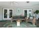 Relaxing screened porch with comfortable seating, plants, and a serene outdoor ambiance at 882 Redwood Way, Lake Wales, FL 33898