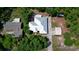 An aerial shot of a single-Gathering home with a white roof, showing its proximity to other homes at 9365 Lemon Dr, Lake Wales, FL 33898