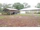 Large backyard with detached metal building, offering ample space and potential at 9365 Lemon Dr, Lake Wales, FL 33898