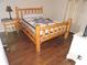 Bedroom featuring a rustic bed frame with hardwood floors and bright natural light at 9365 Lemon Dr, Lake Wales, FL 33898