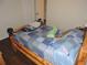 This bedroom offers a cozy atmosphere with a patchwork quilt and rustic decor at 9365 Lemon Dr, Lake Wales, FL 33898