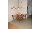 Eat in kitchen area with small table and four chairs, with decorative decor hanging on the walls at 9365 Lemon Dr, Lake Wales, FL 33898