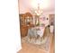 Formal dining room with wooden table, chairs, china cabinet and area rug at 9365 Lemon Dr, Lake Wales, FL 33898