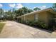 View of the side exterior of the home, with a long driveway at 9365 Lemon Dr, Lake Wales, FL 33898