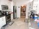 Functional kitchen featuring modern appliances, white cabinets, and tile floors at 9365 Lemon Dr, Lake Wales, FL 33898