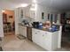 This kitchen features white cabinets, stainless steel appliances, and lots of counter space at 9365 Lemon Dr, Lake Wales, FL 33898