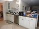This kitchen features white cabinets, stainless steel appliances, and lots of counter space at 9365 Lemon Dr, Lake Wales, FL 33898