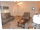 Inviting living room with hardwood floors, neutral decor, and comfortable seating arrangements at 9365 Lemon Dr, Lake Wales, FL 33898