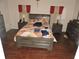 This bedroom features hardwood floors, a ceiling fan, and plenty of closet space at 9365 Lemon Dr, Lake Wales, FL 33898