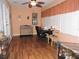 Bright and spacious office featuring a ceiling fan, wood laminate flooring, and workspace at 9365 Lemon Dr, Lake Wales, FL 33898