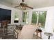 Sunroom with comfortable seating, ceiling fan and natural light, showcasing a relaxing space at 9365 Lemon Dr, Lake Wales, FL 33898