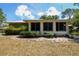 View of the home's sunroom and fenced yard, great for outdoor enjoyment and privacy at 9365 Lemon Dr, Lake Wales, FL 33898