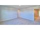 Bedroom with neutral carpet features a closet door and a bathroom door at 1417 Leamington Ln, Winter Haven, FL 33884