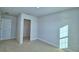 Bedroom with carpet, natural light, and walk-in closet at 1417 Leamington Ln, Winter Haven, FL 33884