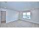 Bright bedroom featuring neutral carpet, recessed lighting, a window with a view, and an open closet at 1417 Leamington Ln, Winter Haven, FL 33884