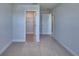 Bedroom showcasing neutral paint, carpet, and walk-in closet at 1417 Leamington Ln, Winter Haven, FL 33884