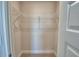 Walk-in closet with carpet and wire shelving, providing practical storage solutions at 1417 Leamington Ln, Winter Haven, FL 33884