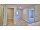 Hallway with carpet flooring and open doorways at 1417 Leamington Ln, Winter Haven, FL 33884