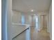 Upstairs hallway with carpet, several doors, and lots of natural light at 1417 Leamington Ln, Winter Haven, FL 33884