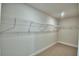 Spacious walk-in closet with wire shelving for organized storage at 1417 Leamington Ln, Winter Haven, FL 33884
