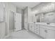 Bathroom featuring a double sink vanity and a tiled glass enclosed walk-in shower at 4502 Fairway Oaks Dr, Mulberry, FL 33860