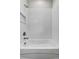 Clean bathtub with showerhead, perfect for relaxation and convenience in a contemporary setting at 4502 Fairway Oaks Dr, Mulberry, FL 33860
