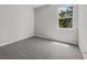 Bedroom featuring plush carpeting and a window with natural light at 4502 Fairway Oaks Dr, Mulberry, FL 33860