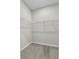 Walk-in closet featuring wire shelving and plush carpeting at 4502 Fairway Oaks Dr, Mulberry, FL 33860