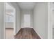 Inviting foyer featuring hardwood floors, neutral wall paint, and direct view of the home's front door at 4502 Fairway Oaks Dr, Mulberry, FL 33860