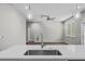 Kitchen featuring an island sink, pendant lights, and an open view into the living room at 4502 Fairway Oaks Dr, Mulberry, FL 33860